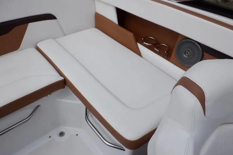 Slide: The Image of Interior seating of 2018 Four Winns HD200 boat with white and brown upholstery. - 39