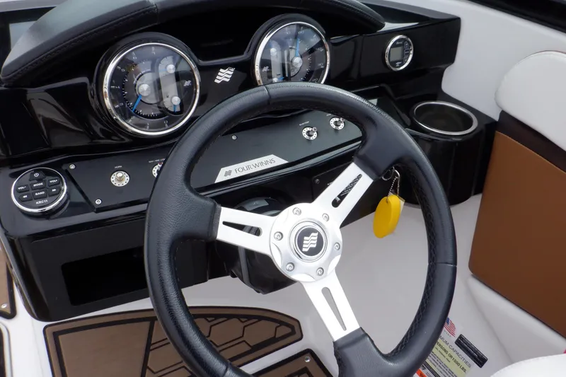 Slide: The Image of Steering wheel and dashboard of 2018 Four Winns HD200 boat. - 47