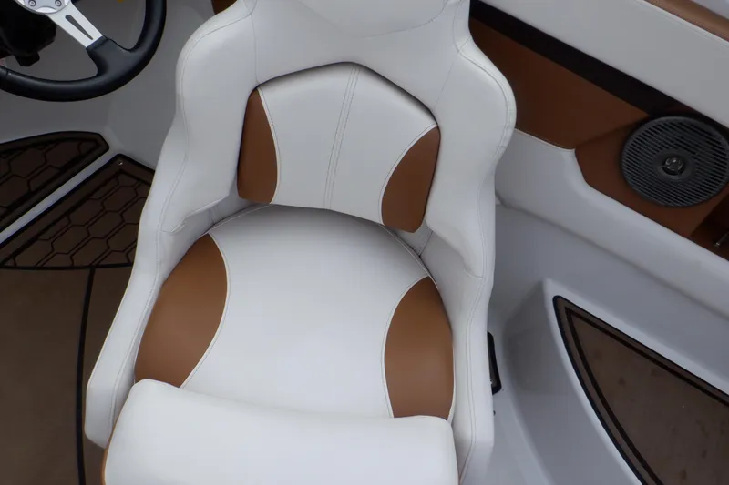 Slide: The Image of 2018 Four Winns HD200 boat interior with white and brown seating. - 48