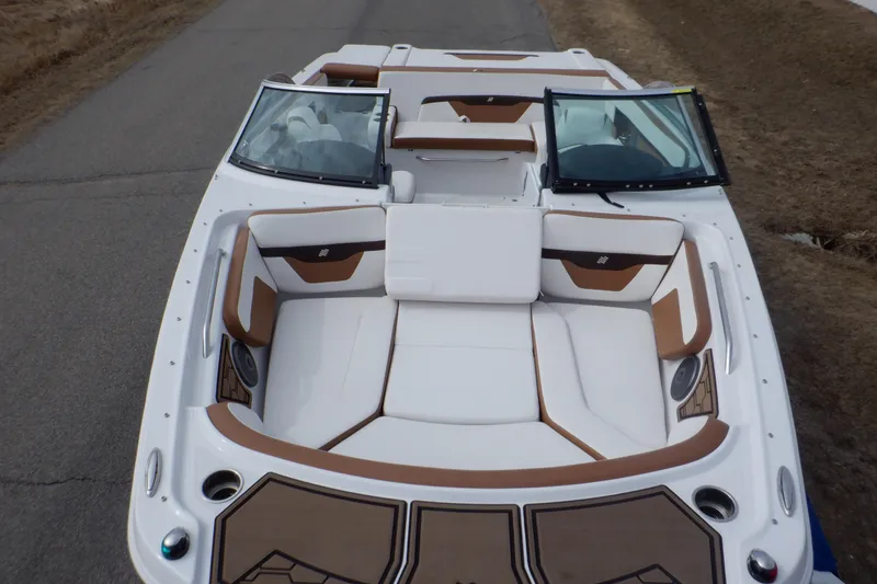 Slide: The Image of 2018 Four Winns HD200 boat with white and brown seating, viewed from above. - 5