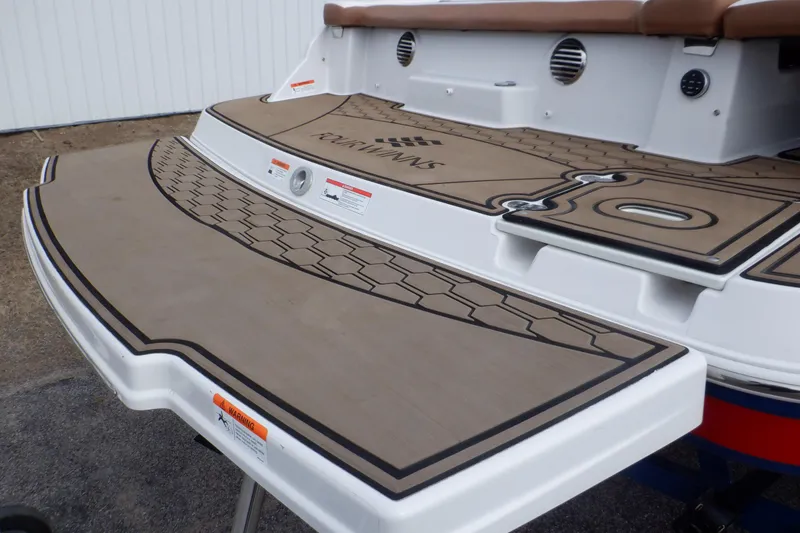 Slide: The Image of 2018 Four Winns HD200 boat deck with brown non-slip surface and stylish design. - 8