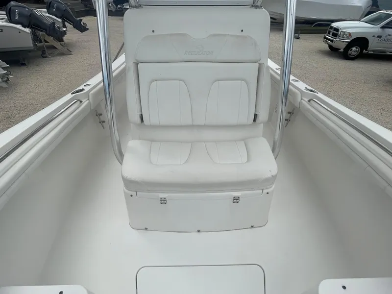 Slide: The Image of 2017 Regulator 23 FS Center Console boat interior with white seating. - 12
