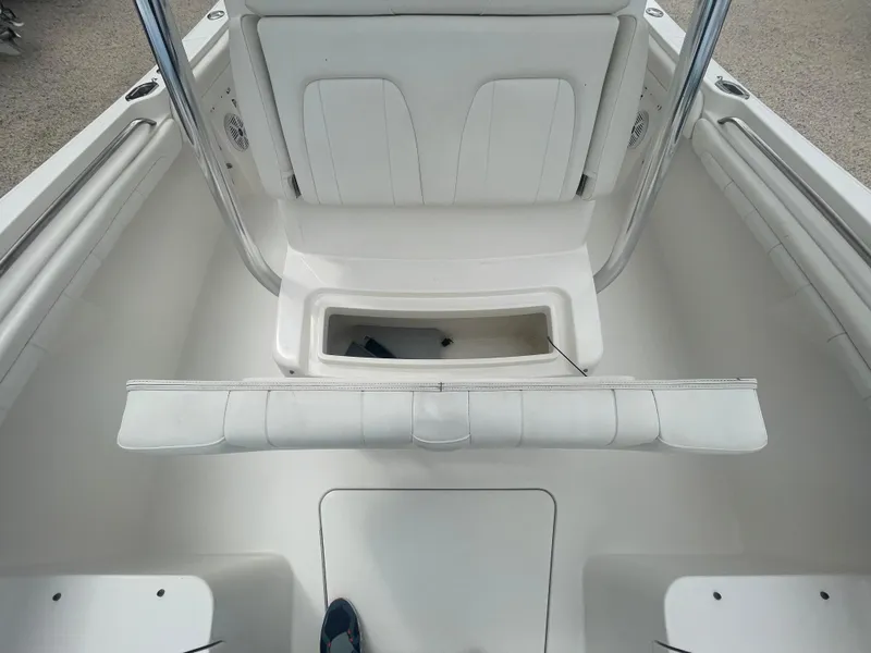 Slide: The Image of 2017 Regulator 23 FS Center Console boat interior with seating and storage. - 13