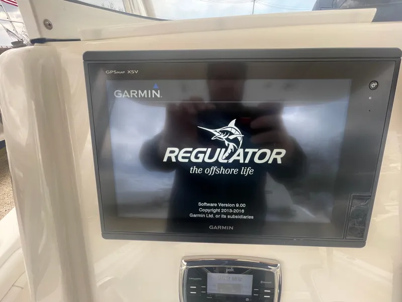 Slide: The Image of Garmin display on 2017 Regulator 23 FS Center Console boat dashboard. - 18