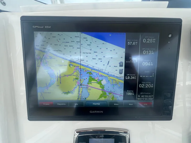 Slide: The Image of Garmin GPS display on 2017 Regulator 23 FS boat showing navigation map and data. - 19
