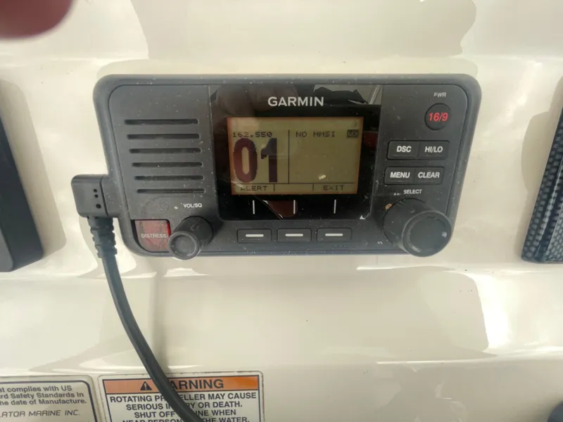 Slide: The Image of Garmin marine radio on 2017 Regulator 23 FS boat dashboard. - 27