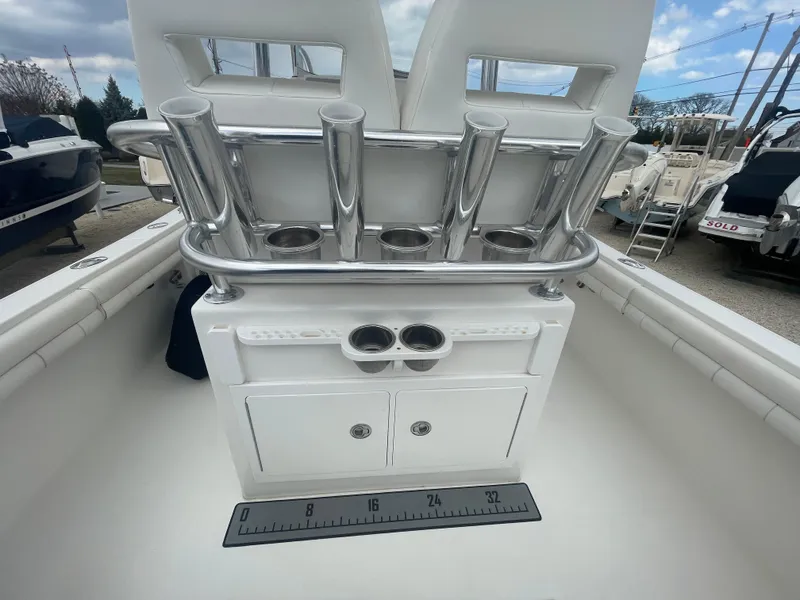 Slide: The Image of 2017 Regulator 23 FS boat with rod holders and storage compartments. - 33
