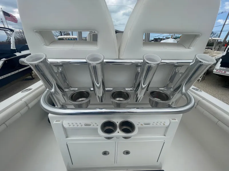 Slide: The Image of 2017 Regulator 23 FS boat with rod holders and storage compartments. - 38