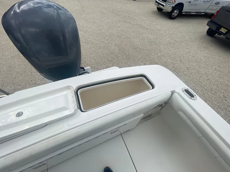 Slide: The Image of 2017 Regulator 23 FS boat interior with motor and storage compartment. - 40