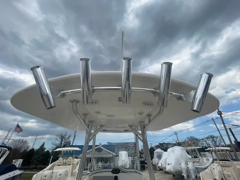 Slide: The Image of 2017 Regulator 23 FS boat with rod holders under cloudy sky. - 41