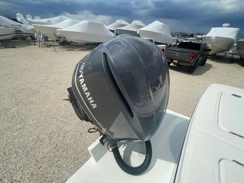 Slide: The Image of 2017 Regulator 23 FS with Yamaha outboard motor in a boatyard. - 42