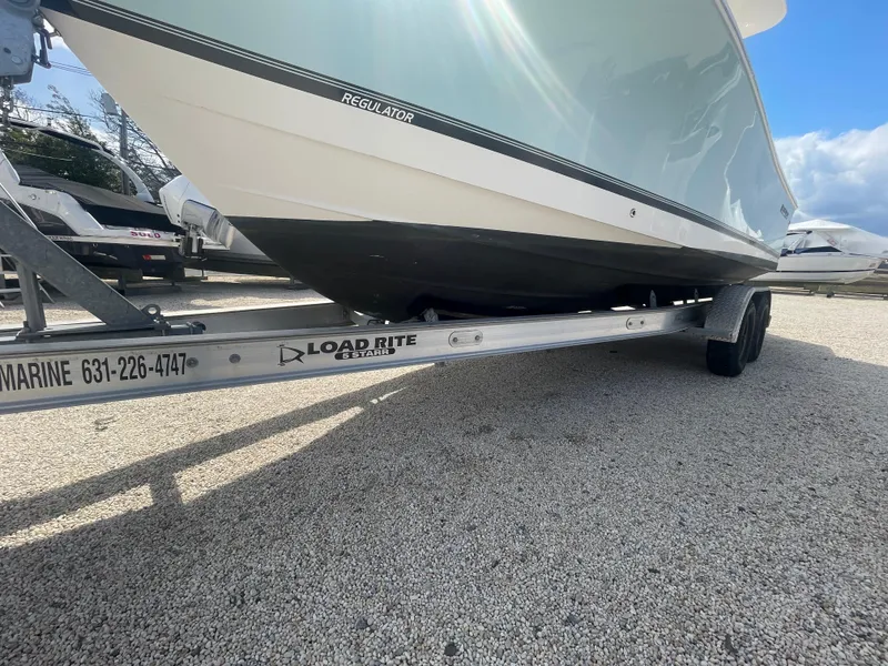 Slide: The Image of 2017 Regulator 23 FS Center Console boat on Load Rite trailer. - 47