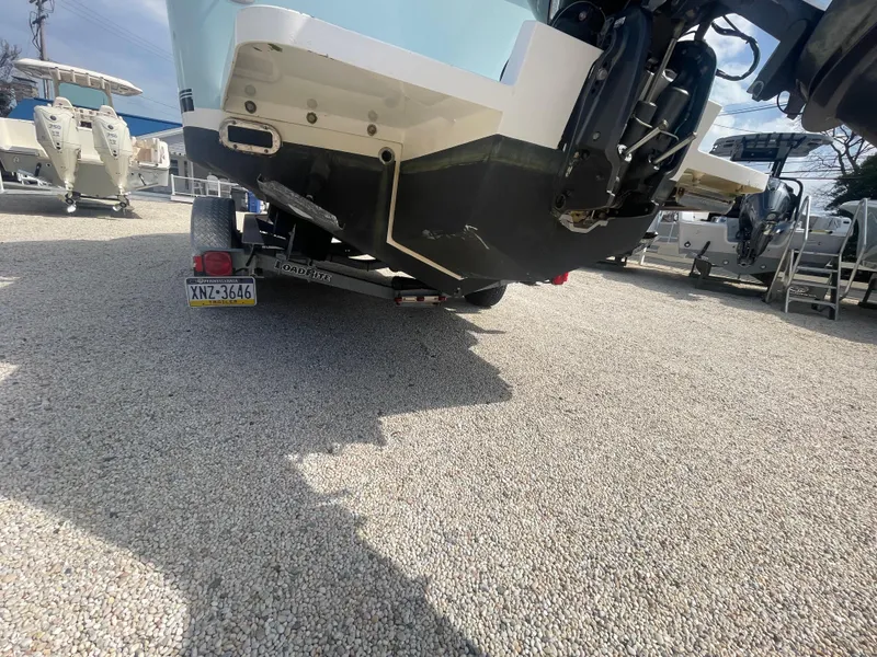 Slide: The Image of 2017 Regulator 23 FS Center Console boat on trailer, rear view. - 49