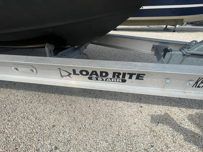 Slide: The Image of Load Rite trailer for 2017 Regulator 23 FS Center Console boat. - 51
