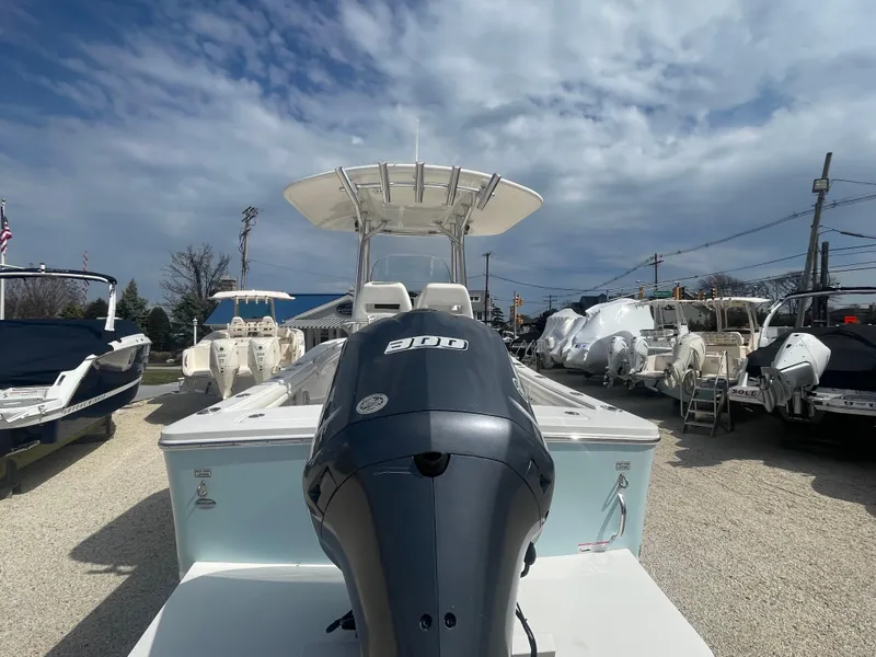 Slide: The Image of 2017 Regulator 23 FS Center Console boat with Yamaha outboard motor, displayed outdoors. - 6