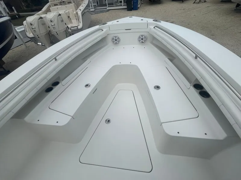 Slide: The Image of 2017 Regulator 23 FS Center Console boat interior with spacious seating and storage compartments. - 9