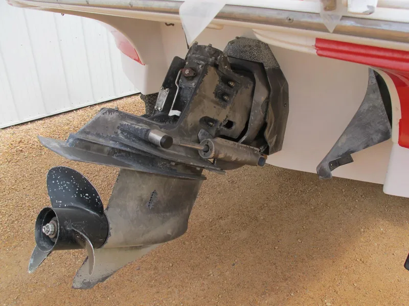 Slide: The Image of Outboard motor of a 2005 Four Winns 194 Funship boat on a trailer. - 10