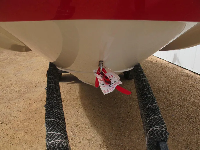 Slide: The Image of 2005 Four Winns 194 Funship boat hull on trailer, red and white design. - 4