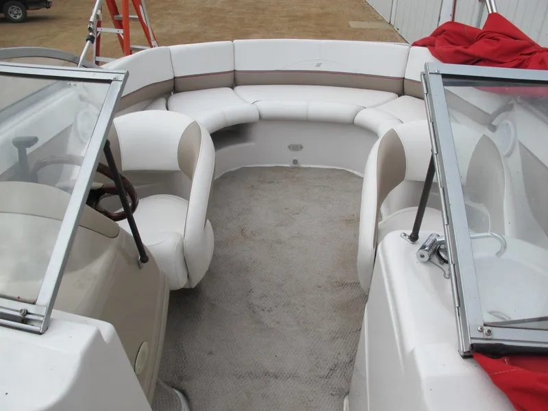 Slide: The Image of 2005 Four Winns 194 Funship boat interior with white seating and windshield. - 6