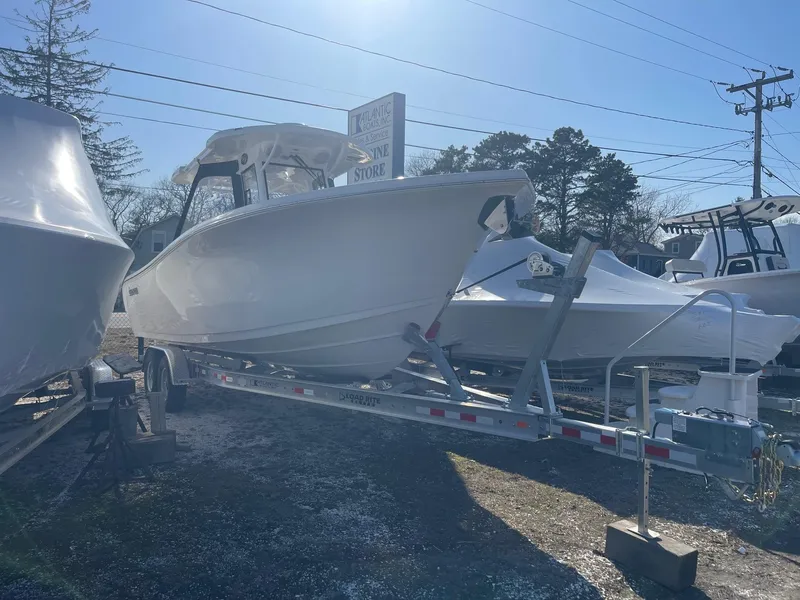Slide: The Image of 2025 Sea Pro 292 Off Shore boat on trailer, displayed outdoors. - 1