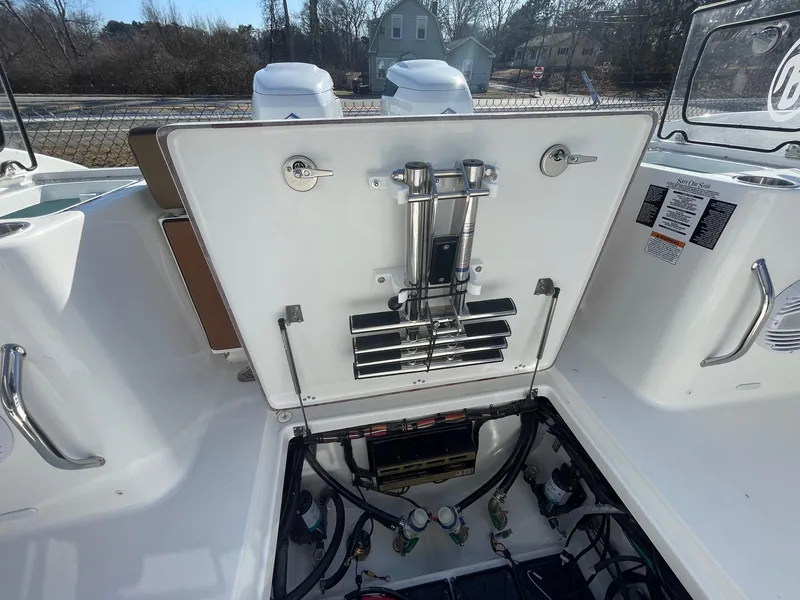 Slide: The Image of 2025 Sea Pro 292 Off Shore boat showing open engine compartment with visible components. - 11