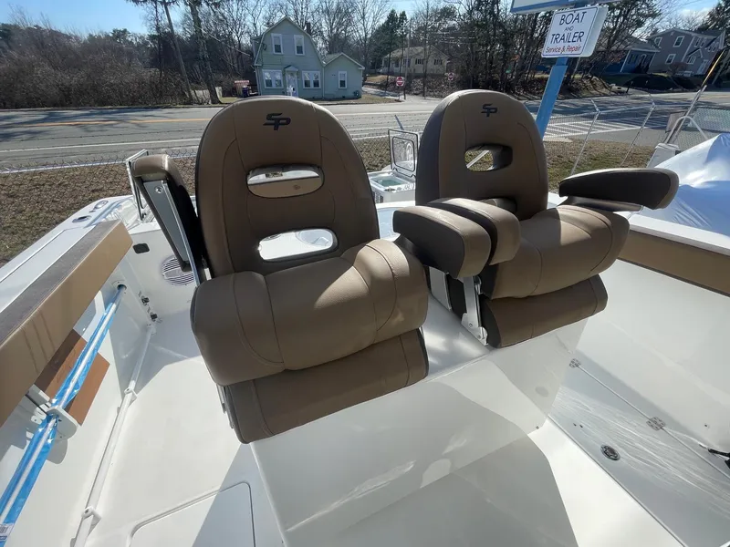 Slide: The Image of 2025 Sea Pro 292 Off Shore boat with dual cushioned seats, outdoor setting. - 16