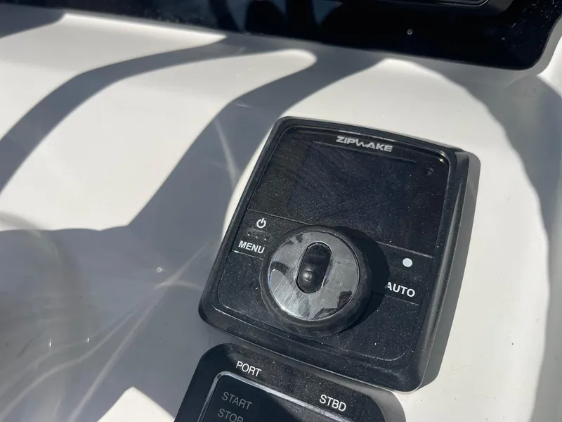 Slide: The Image of Control panel on 2025 Sea Pro 292 Off Shore boat, featuring Zipwake system. - 21