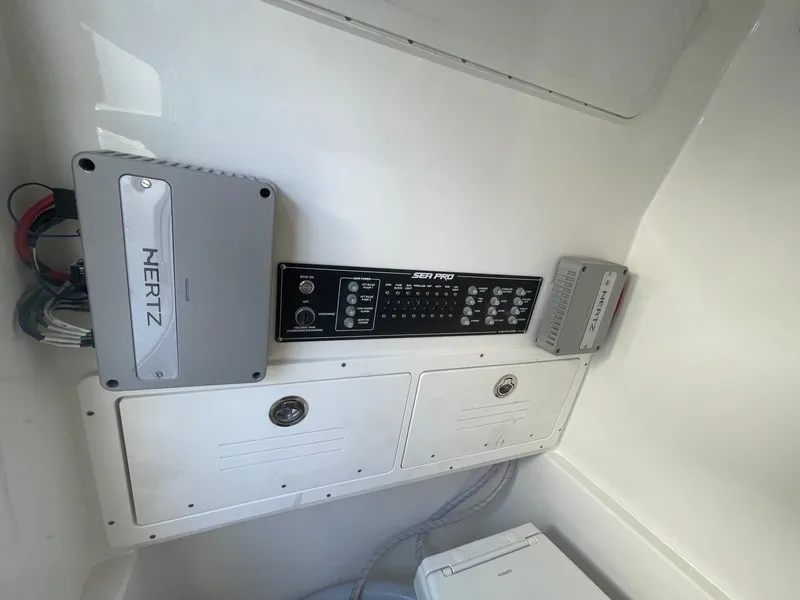 Slide: The Image of 2025 Sea Pro 292 Off Shore boat interior with control panel and audio system. - 27