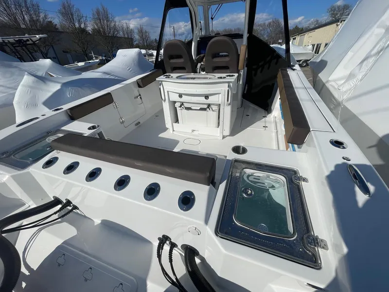 Slide: The Image of 2025 Sea Pro 292 Off Shore boat interior with seating and storage compartments. - 5