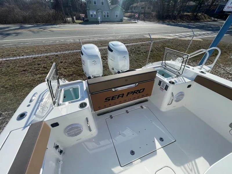 Slide: The Image of 2025 Sea Pro 292 Off Shore boat deck with dual engines and seating area. - 6
