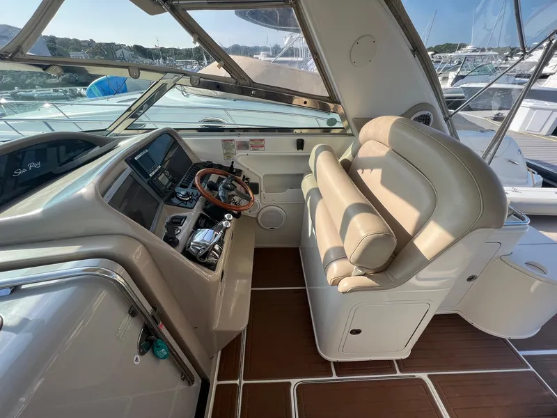 Slide: The Image of 2001 Sea Ray 340 Amberjack helm with leather seating and wooden steering wheel. - 15