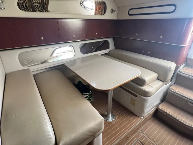 Slide: The Image of Interior of 2001 Sea Ray 340 Amberjack with dining area and seating. - 18