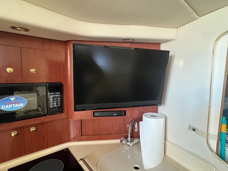 Slide: The Image of Interior of 2001 Sea Ray 340 Amberjack with TV, microwave, and sink. - 19