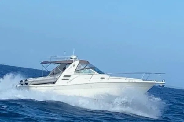 Slide: The Image of 2001 Sea Ray 340 Amberjack cruising on open water. - 2
