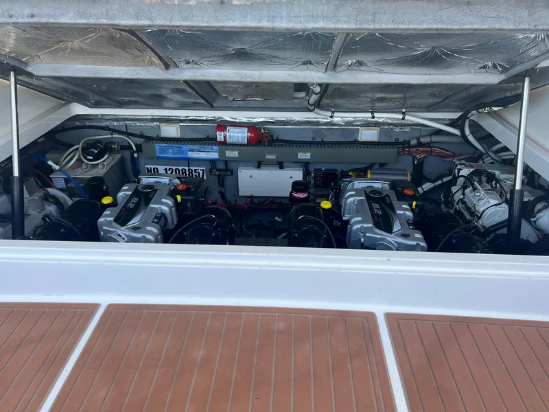 Slide: The Image of Engine compartment of a 2001 Sea Ray 340 Amberjack boat, showcasing dual engines. - 25
