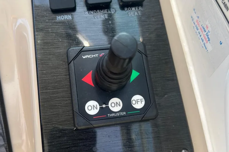 Slide: The Image of Control panel of a 2001 Sea Ray 340 Amberjack boat with thruster joystick. - 27