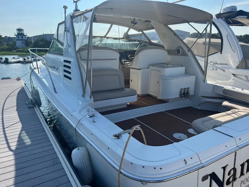 Slide: The Image of 2001 Sea Ray 340 Amberjack docked, featuring spacious seating and sleek design. - 3
