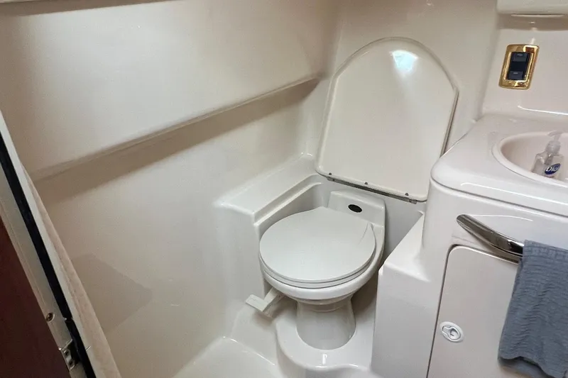 Slide: The Image of 2001 Sea Ray 340 Amberjack boat bathroom with toilet and sink. - 31