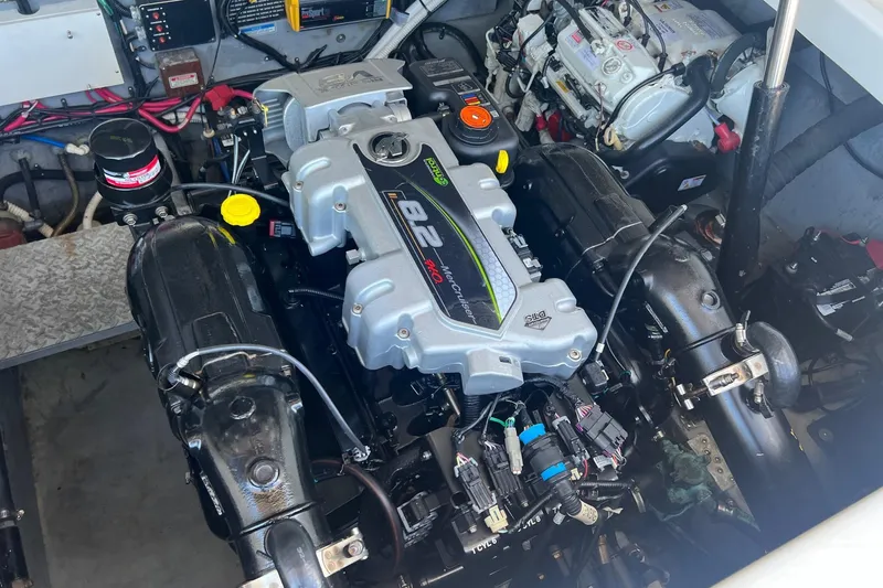 Slide: The Image of Engine compartment of a 2001 Sea Ray 340 Amberjack boat, featuring a MerCruiser engine. - 32