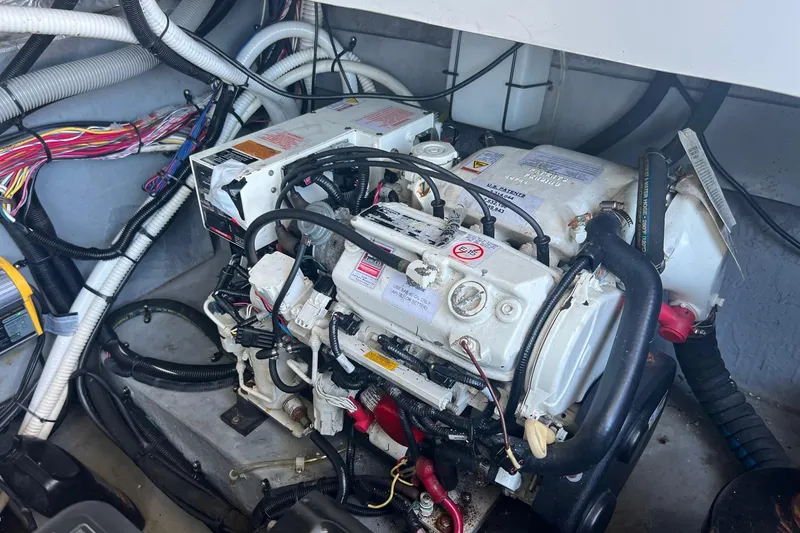 Slide: The Image of Engine compartment of a 2001 Sea Ray 340 Amberjack boat, showing detailed wiring and components. - 33