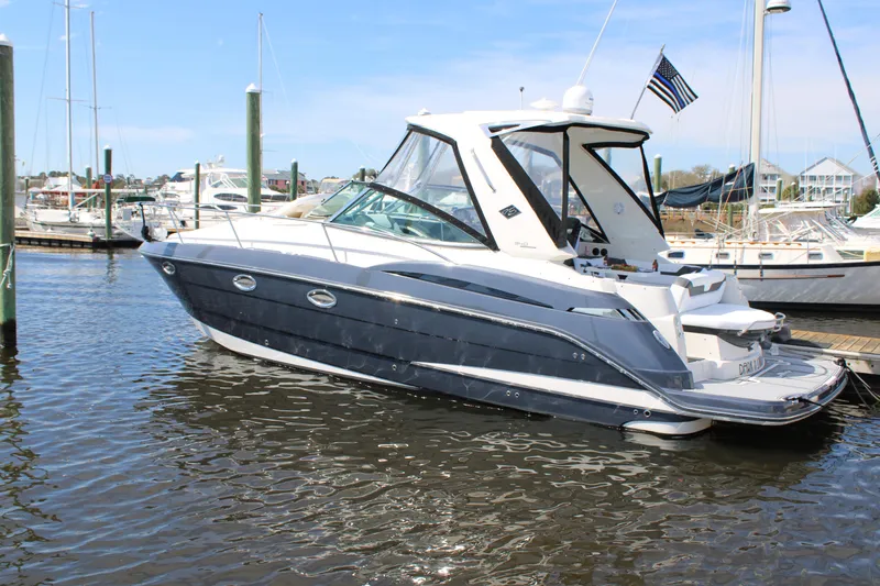 Slide: The Image of 2013 Monterey 340 Sport Yacht docked in a marina, side view. - 15