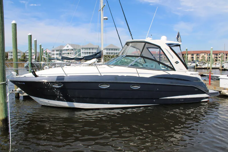 Slide: The Image of 2013 Monterey 340 Sport Yacht docked in a marina, featuring sleek design and modern amenities. - 16