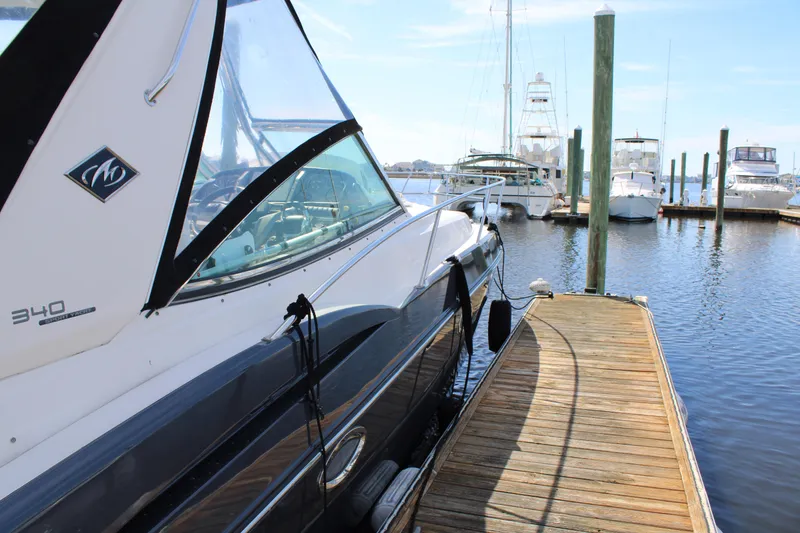 Slide: The Image of 2013 Monterey 340 Sport Yacht docked at marina, side view. - 17