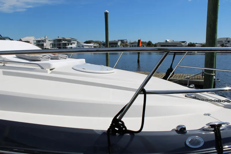 Slide: The Image of 2013 Monterey 340 Sport Yacht docked by waterfront homes. - 21