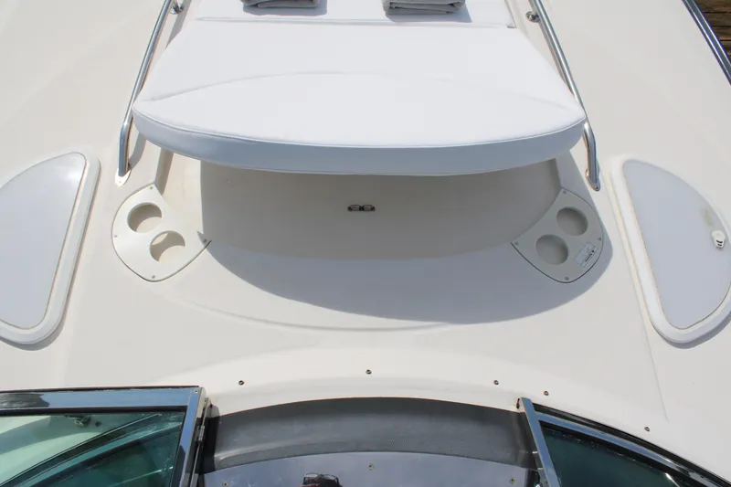 Slide: The Image of 2013 Monterey 340 Sport Yacht deck with cup holders and hatch. - 25
