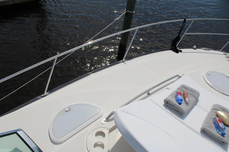 Slide: The Image of 2013 Monterey 340 Sport Yacht deck with towels and water view. - 26