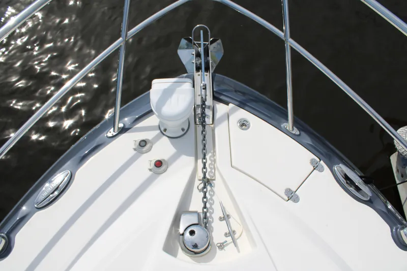Slide: The Image of Bow view of 2013 Monterey 340 Sport Yacht with anchor and chain mechanism. - 34