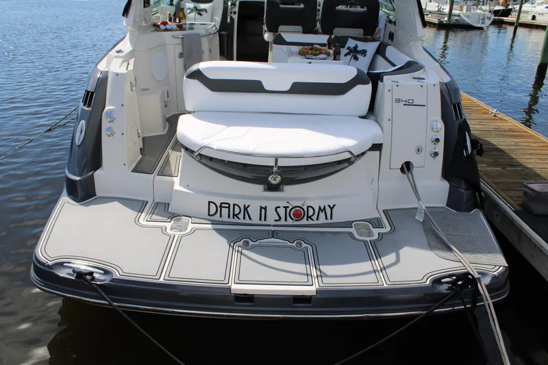 Slide: The Image of 2013 Monterey 340 Sport Yacht docked, featuring "Dark n Stormy" name on the stern. - 38