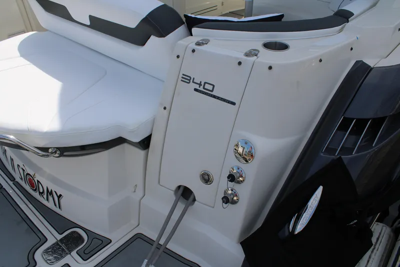 Slide: The Image of 2013 Monterey 340 Sport Yacht, white seating and control panel detail. - 39