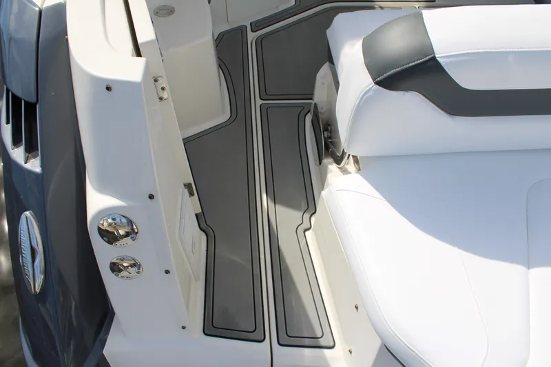 Slide: The Image of 2013 Monterey 340 Sport Yacht interior with white seating and gray flooring. - 44